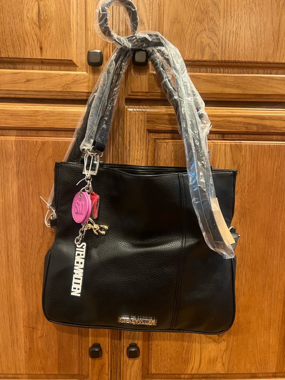 Steve Madden Black Pebbled Tote with Pink Charm Accent